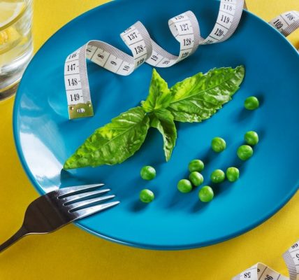 Diet blue plate with centimeter peas and basil